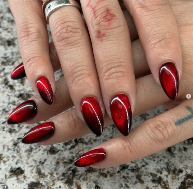 Red marble effect stiletto nails