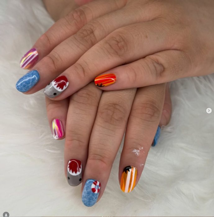 Colorful shark week themed nail art